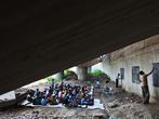 A School Under A Railway Bridge. A Free School for Poor Children