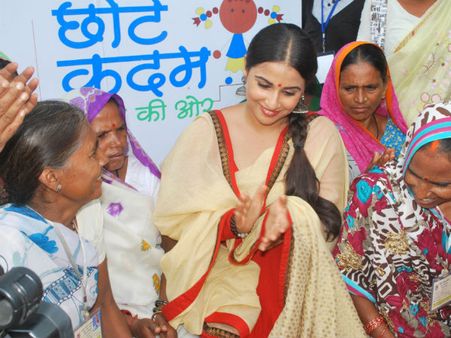 Vidya encouraging the self help group women to continue their work on education