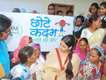 Vidya speaking to self help group women about their concerns on education
