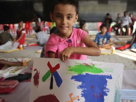 A child with his painting at Kochi Muziris Biennale 