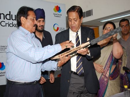Mr. Chandu Borde & Mr. Chetan Chauhan Signing the Cricket Bat