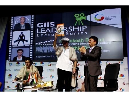 Rakesh Roshan releasing GIIS World magazine while Hrithik Roshan pens a message for GIIS students at GIIS Leadership Lecture Series