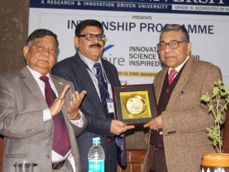 Dr Rajnikant Tiwari receiving memento during the occasion